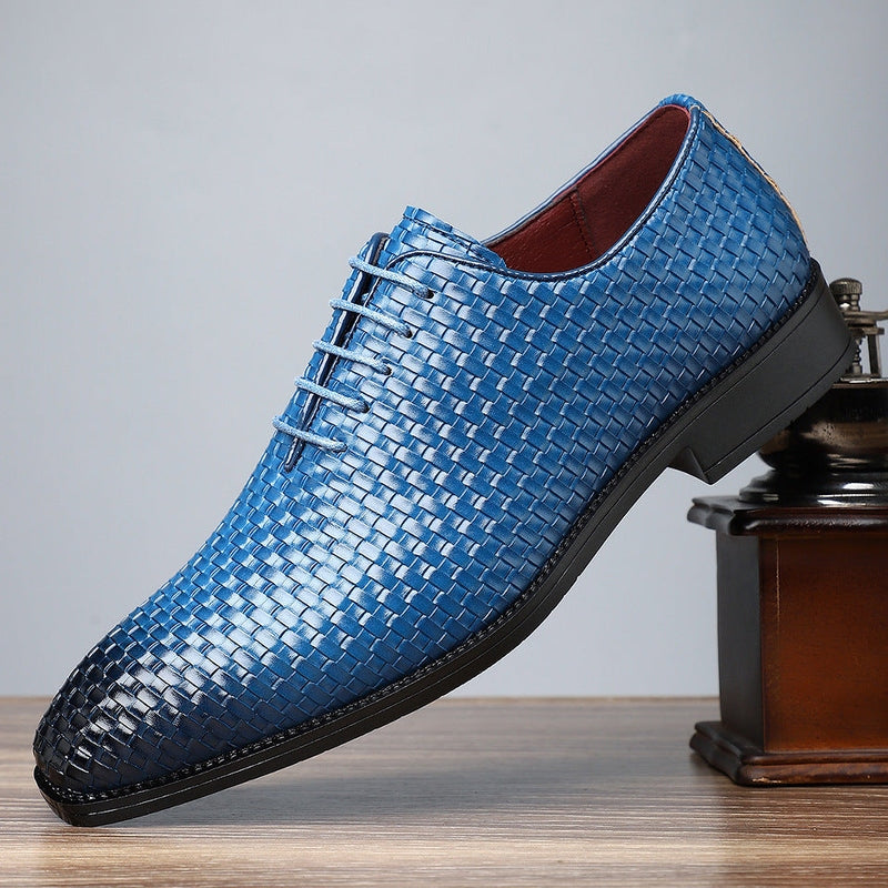 Close-up of blue PU leather lace-up shoe texture and stitching