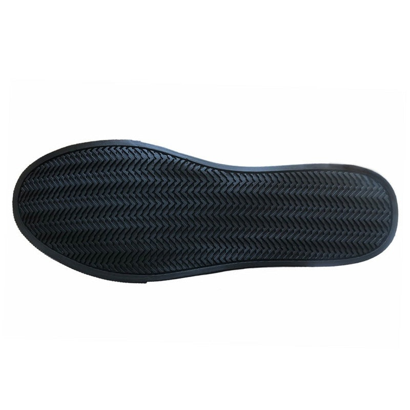 Black rubber sole with chevron herringbone tread for traction
