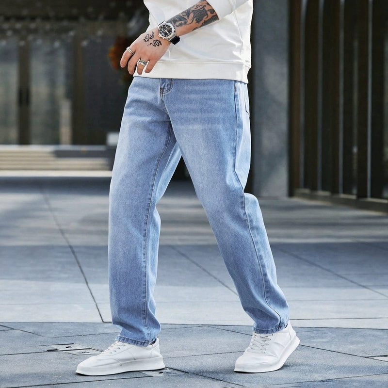 Side profile of men's full-length vintage denim jeans highlighting fabric drape and fit