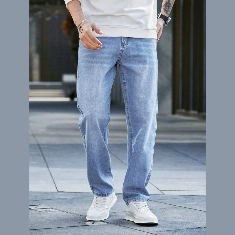 Men's relaxed fit blue washed denim jeans frontal shot displaying clean solid pattern