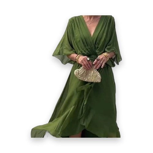 Close-up of olive green wrap dress V-neckline and gathered waist detail