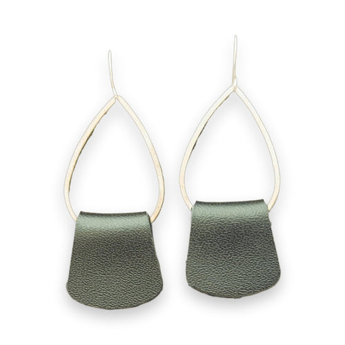 Silver-toned black leather drop earrings displayed side-by-side on distressed wood