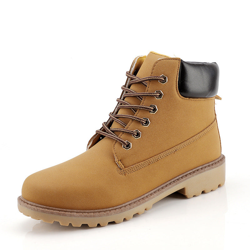 Yellow-tan high-top snow boot with decorative side stitching