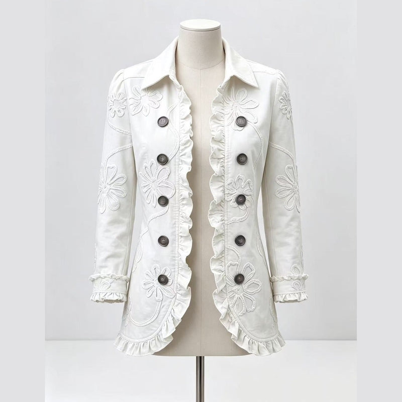 White mannequin display of ruffled lapel blazer with embroidery