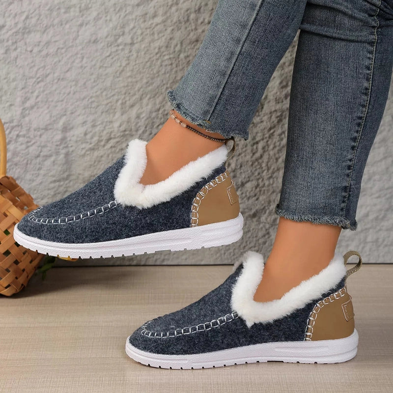 Dark blue textured slip-ons with silver chain-stitch detailing