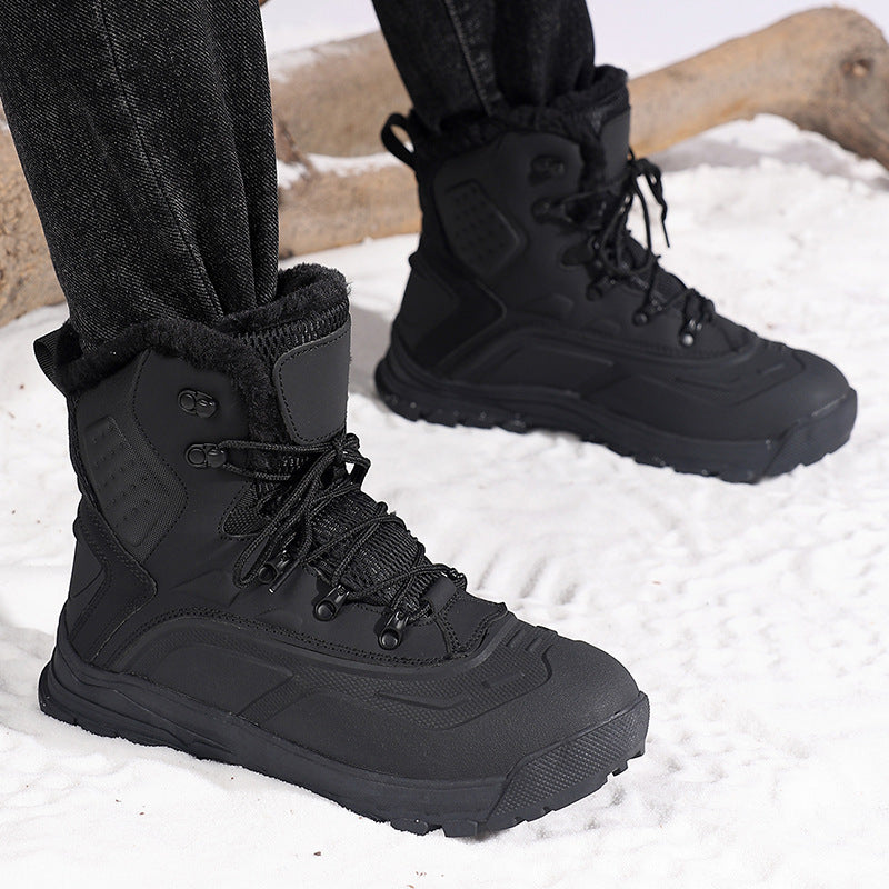 Black winter boots in snow 