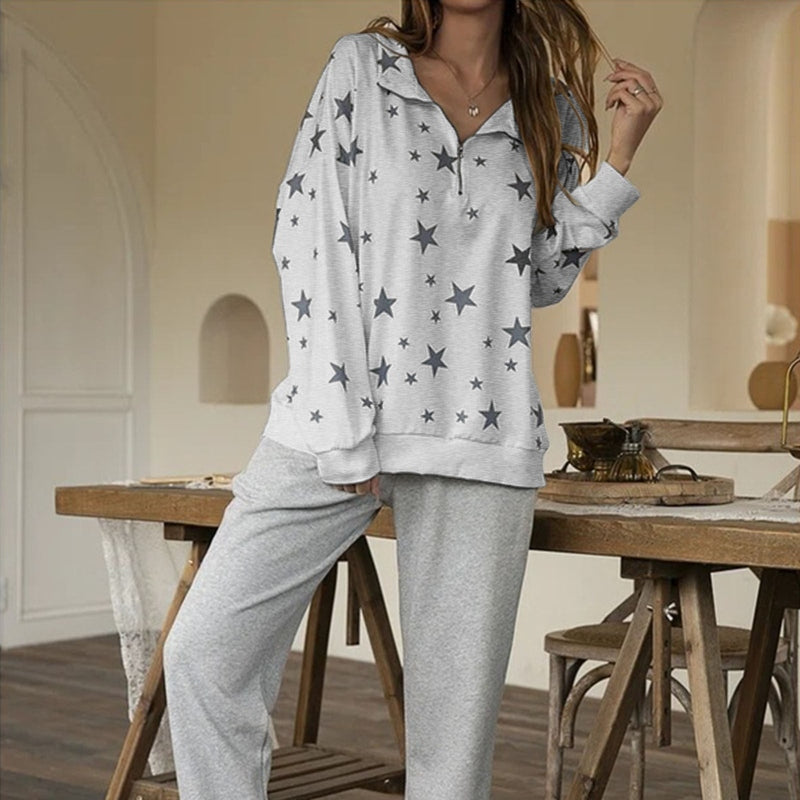 White heathered women's zip-up sweatshirt featuring scattered star print