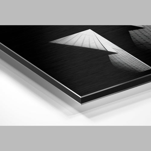 Black and white geometric building metal wall art angled edge view