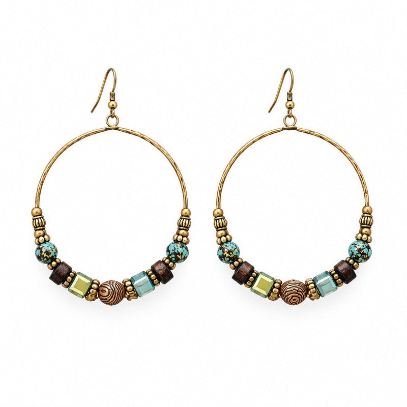 Close-up of beaded hoop earrings showing wood, stone, and metal textures