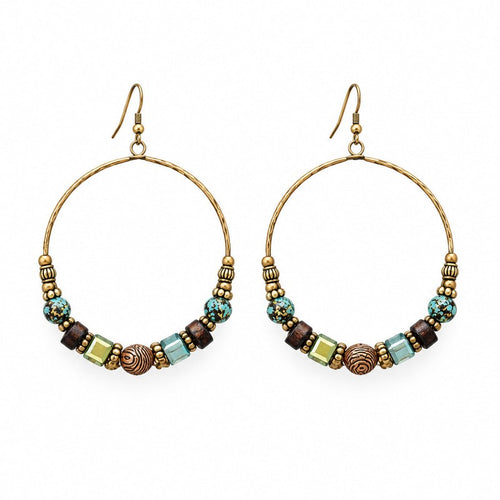 Close-up of beaded hoop earrings showing wood, stone, and metal textures