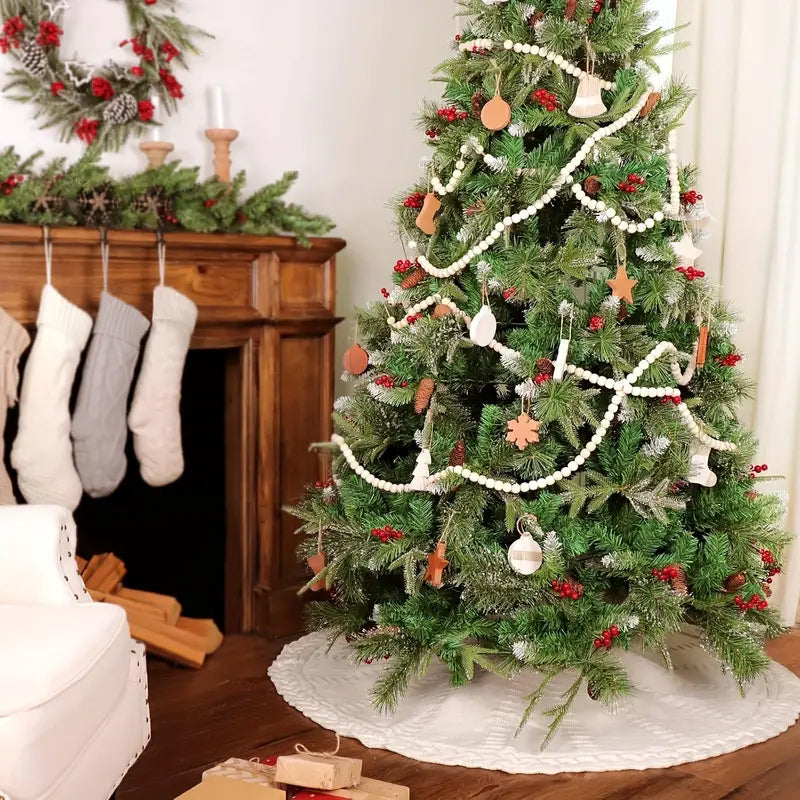 Ivory knitted tree skirt under decorated Christmas tree in living room setting