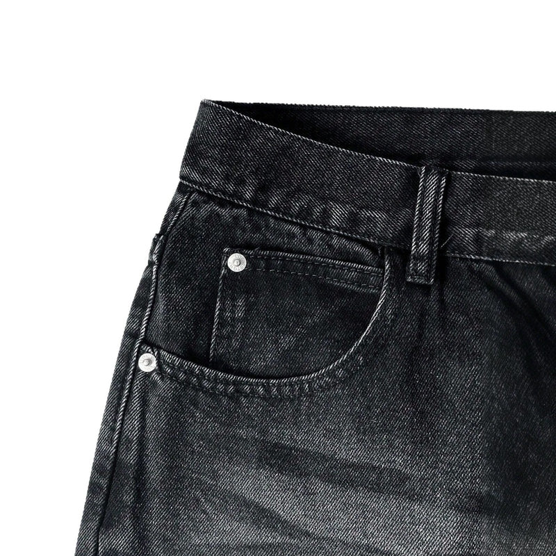Close-up of black cotton pants waistband, belt loops and silver rivets