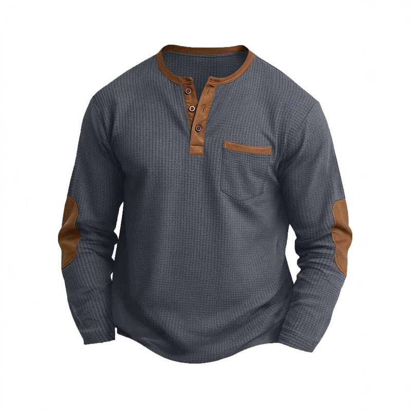 Dark grey waffle-knit long sleeve henley shirt flat lay showing brown contrast collar and pockets