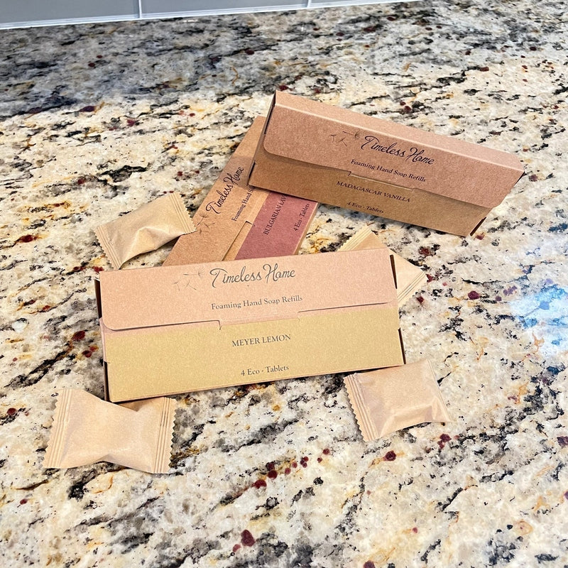 Meyer Lemon, Madagascar Vanilla, and Bulgarian Lavender hand soap refills on counter
