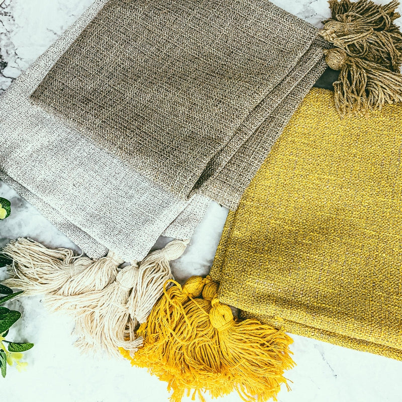Mustard, taupe, and oatmeal cotton linen pillow covers showing coarse weave