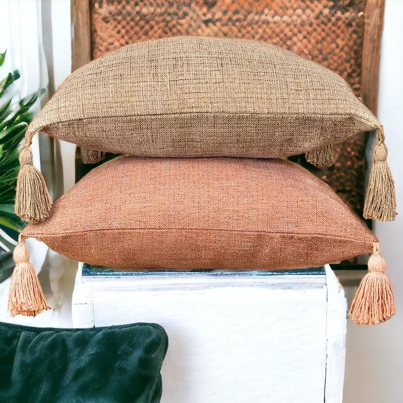Natural brown and terracotta orange pillow cases with large corner tassels