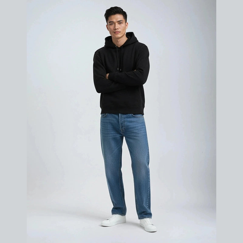 Men's black heavyweight pullover hoodie styled with jeans
