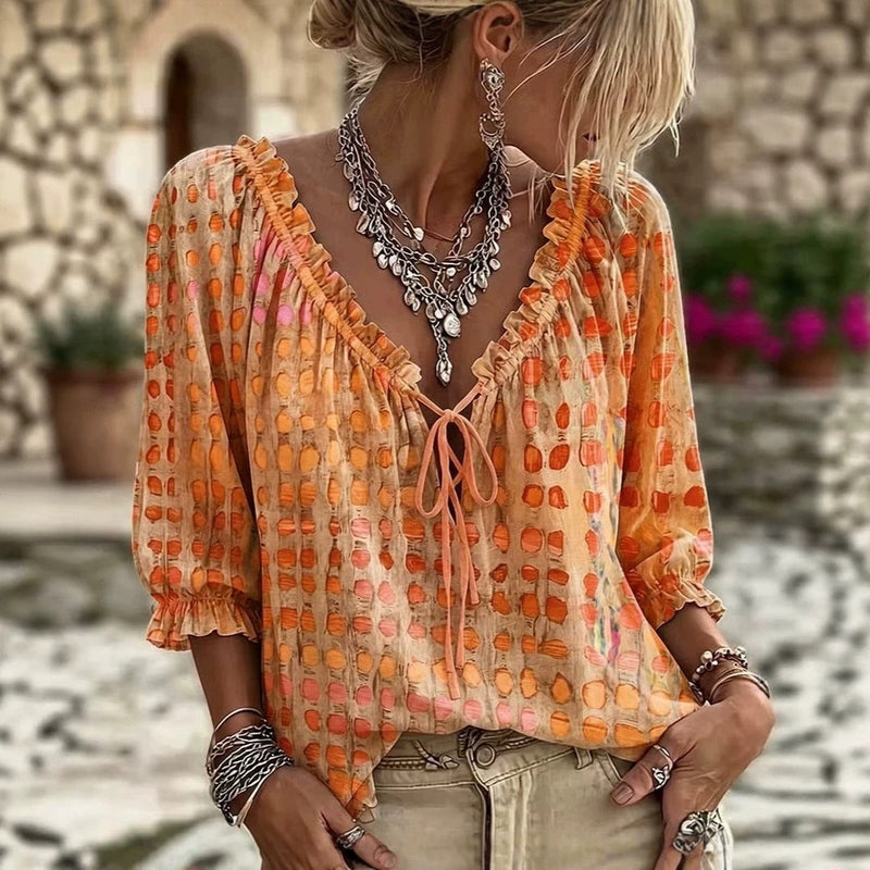 Orange red polka-dot ethnic print pullover shirt with elastic cuffs and front tie detail