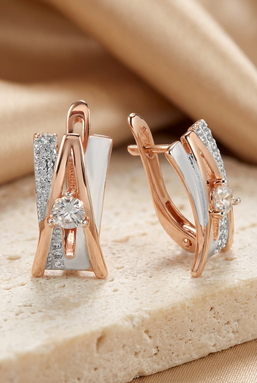Angular crossover earrings with round center stones, detail view