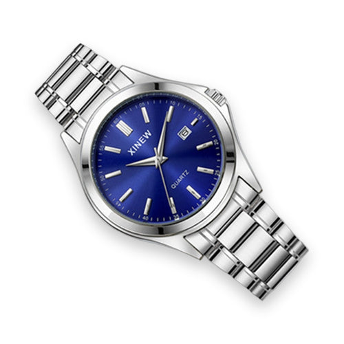 Lifestyle shot of silver blue dial watch draped over white ceramic cup rim