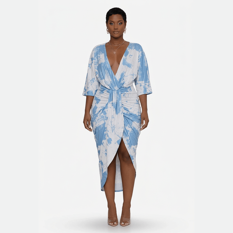 Blue and white dress modeled against a clean white background