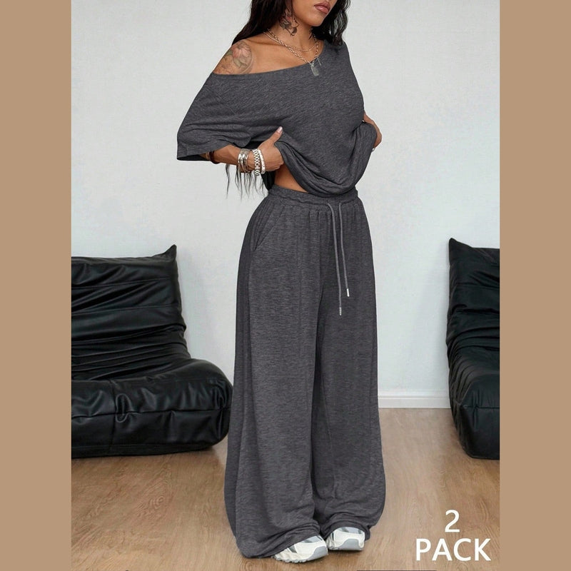 Dark gray two-piece set with off-shoulder top and wide-leg pants, side fit detail