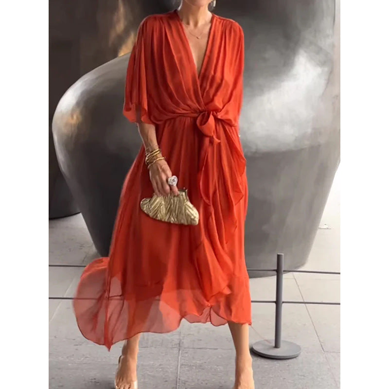 Rust orange flowy dress with knotted waist and wide sleeves