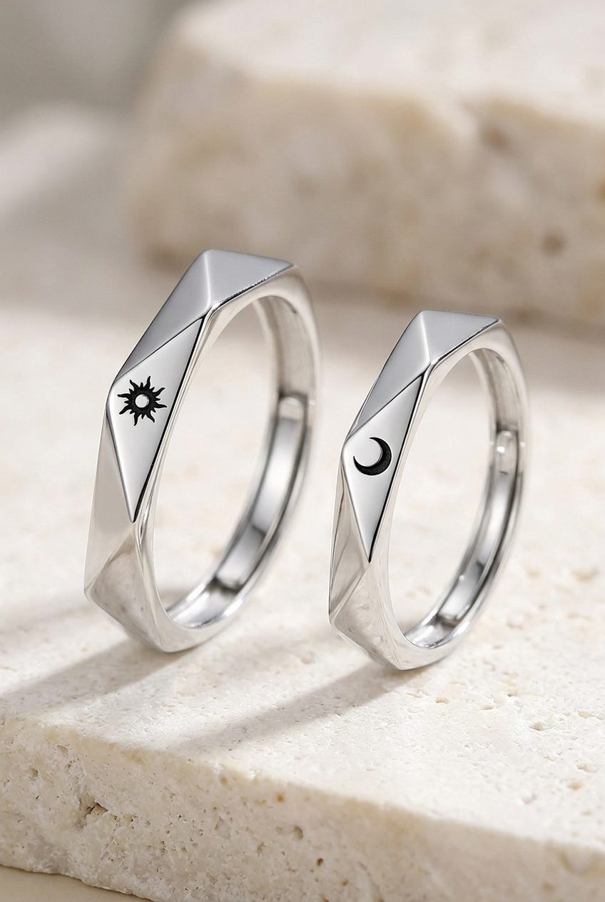 Close-up of the sun-and-moon symbols and faceted bands