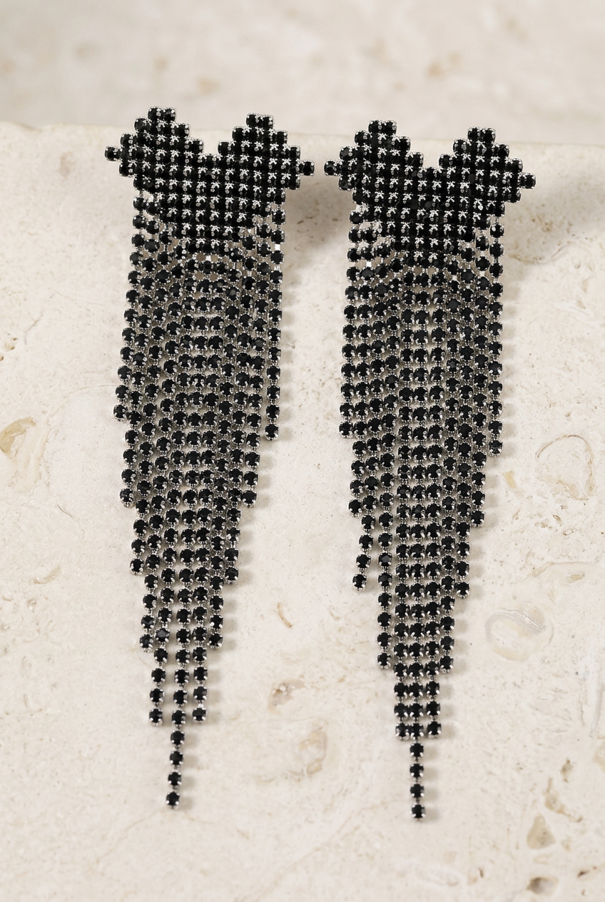 Detail view of the black-stone fringe earrings