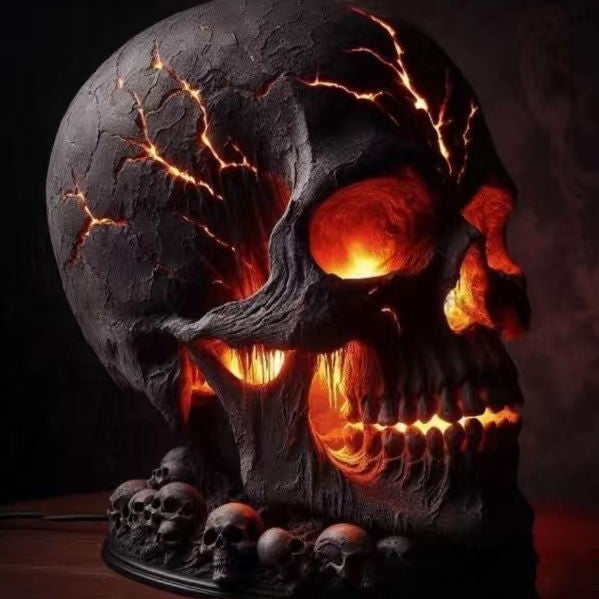 Close-up of resin skull lamp showing glowing eye sockets and vein-like crack details