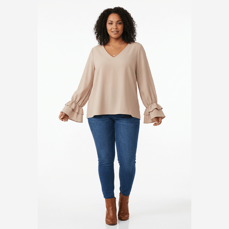 Full-length model wearing the blouse on a white background
