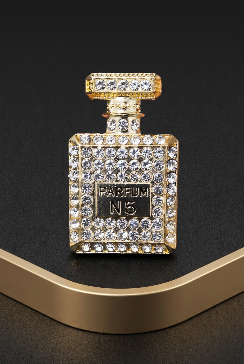 Gold-tone perfume-shaped vent ornament cinematic hero