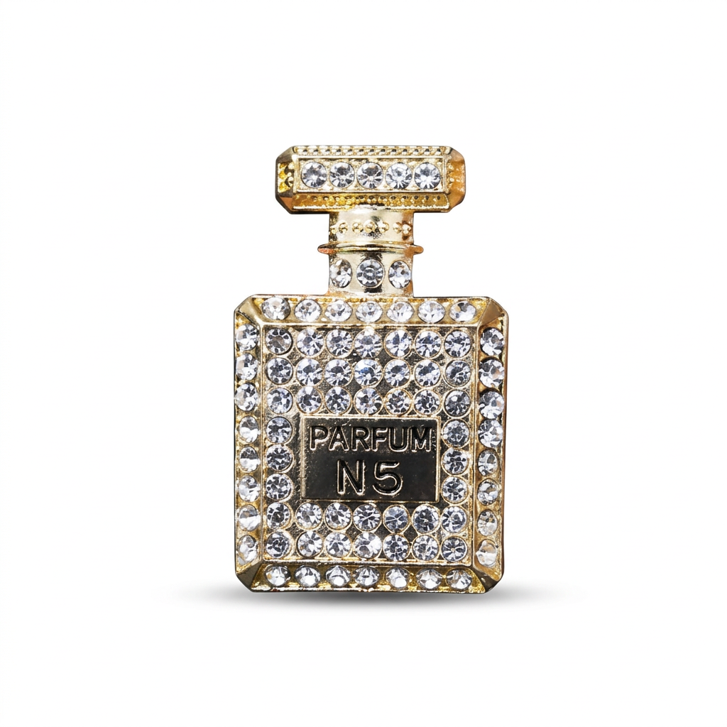 Gold-tone perfume-shaped vent ornament on pure white