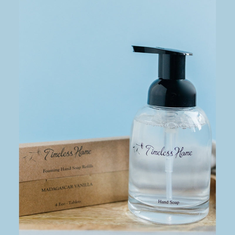 Madagascar Vanilla hand soap in clear dispenser next to refill packaging