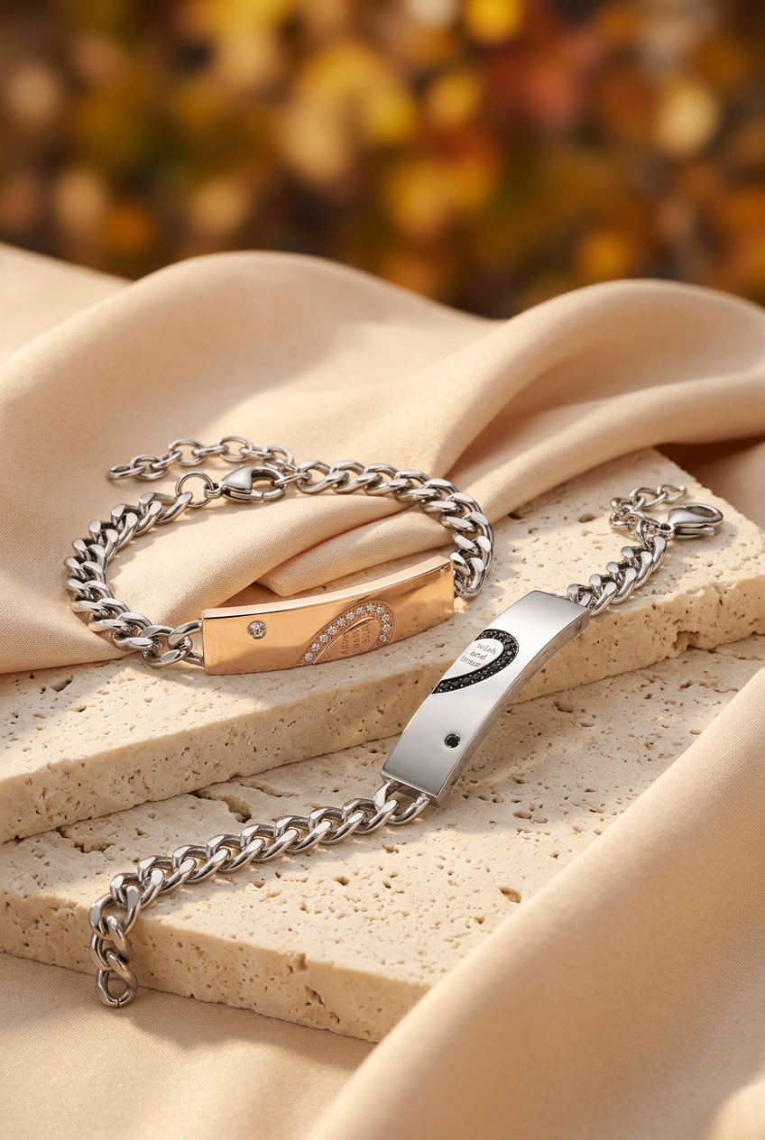 Rose gold-tone and silver-tone couple bracelets with stone-set heart details on ivory stone and champagne fabric.