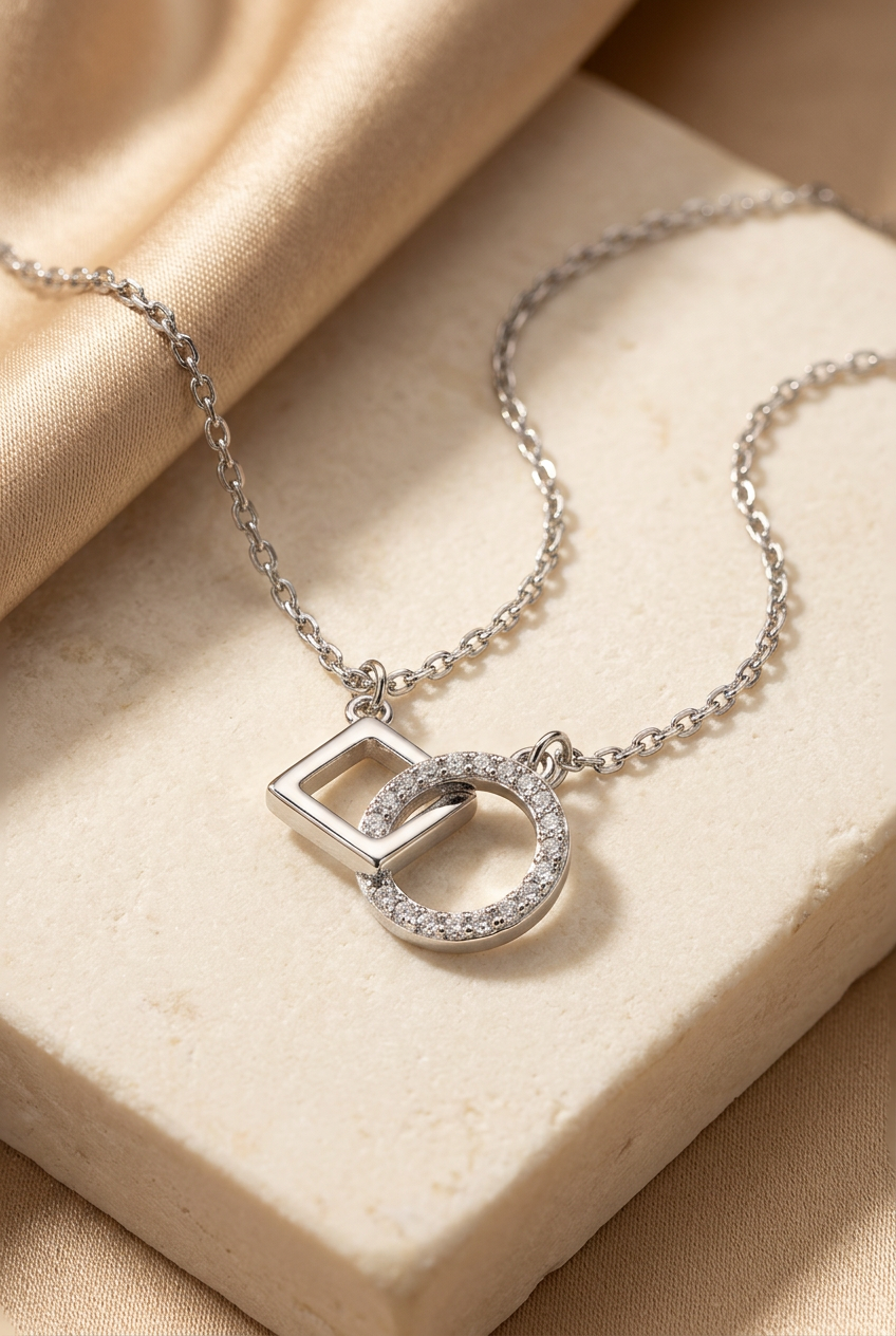 Interlocking square-and-circle necklace styled on ivory stone