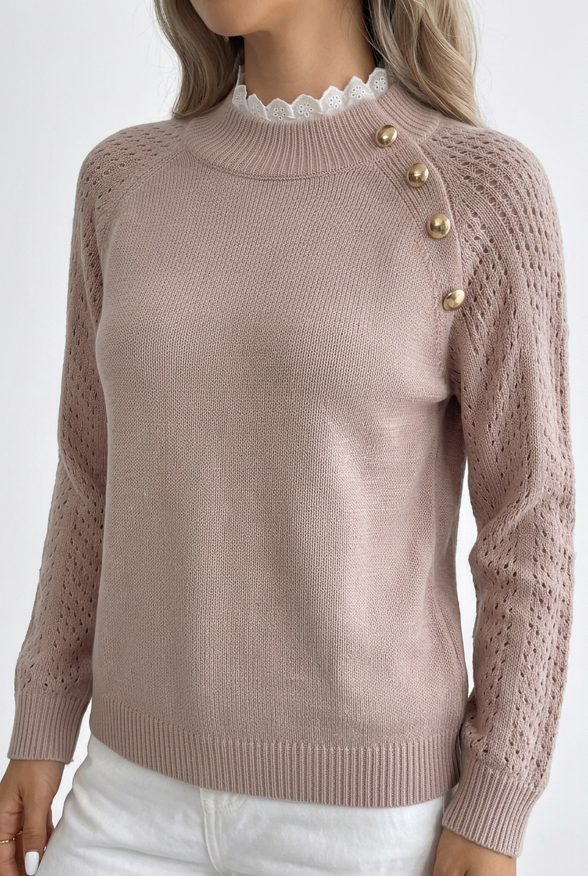 Lace Signature sweater close-up showing openwork sleeves, gold shoulder buttons and scalloped white collar
