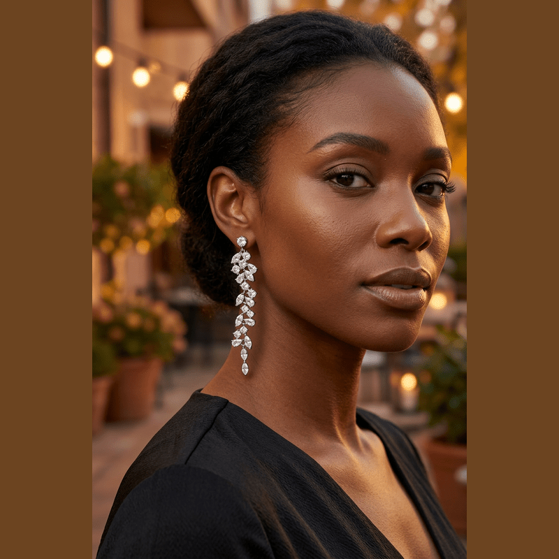 Model wearing a silver-tone cascading clear-stone earring