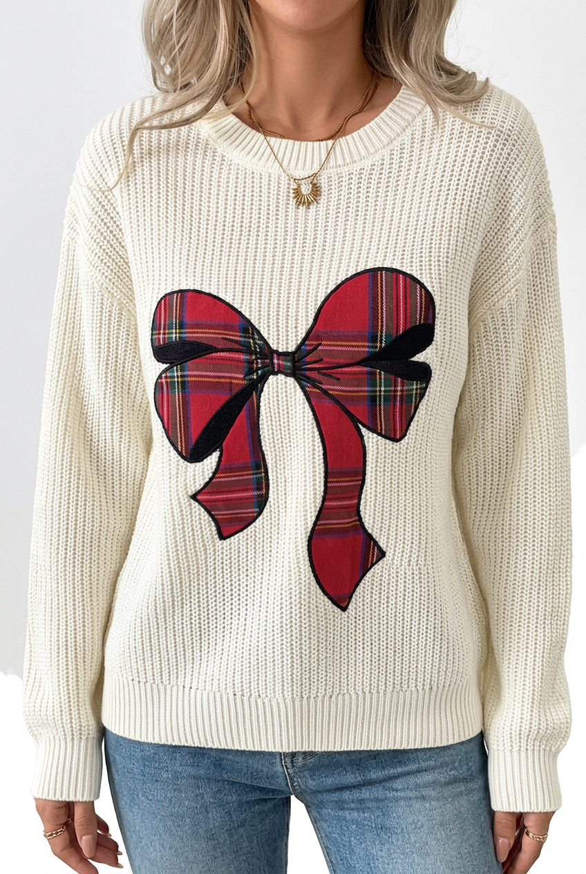 Close-up of Ribbon Social off-white knit texture, red tartan bow motif and ribbed trim