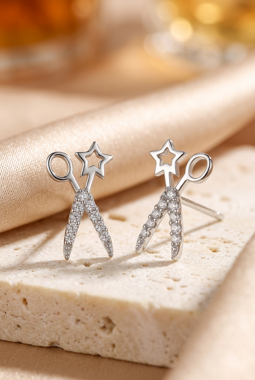 Scissor-shaped studs styled on ivory stone and silk