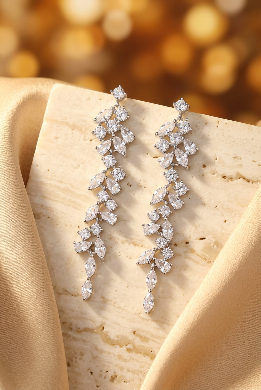 Silver-tone cascading earrings styled on ivory stone and silk